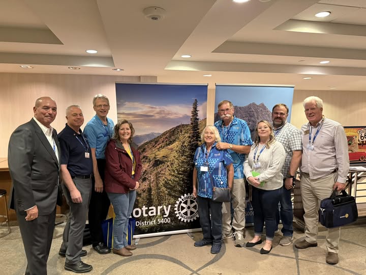 Kathy Buck with Rotary 5400 Banner